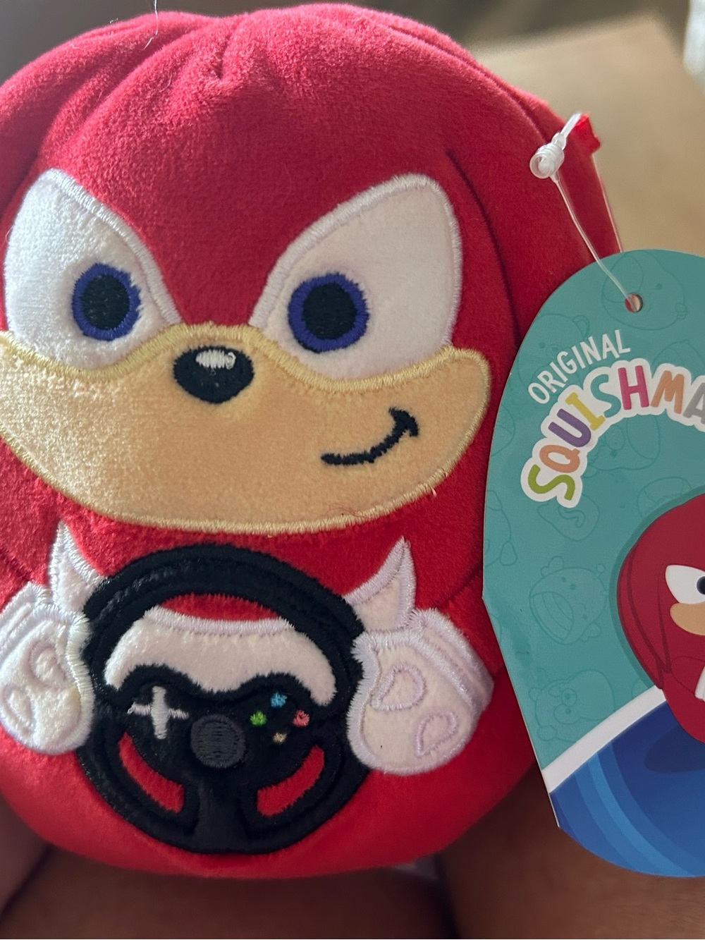 Squishmallows Red and Cream Knuckles-Inspired Plush with Steering Wheel Applique